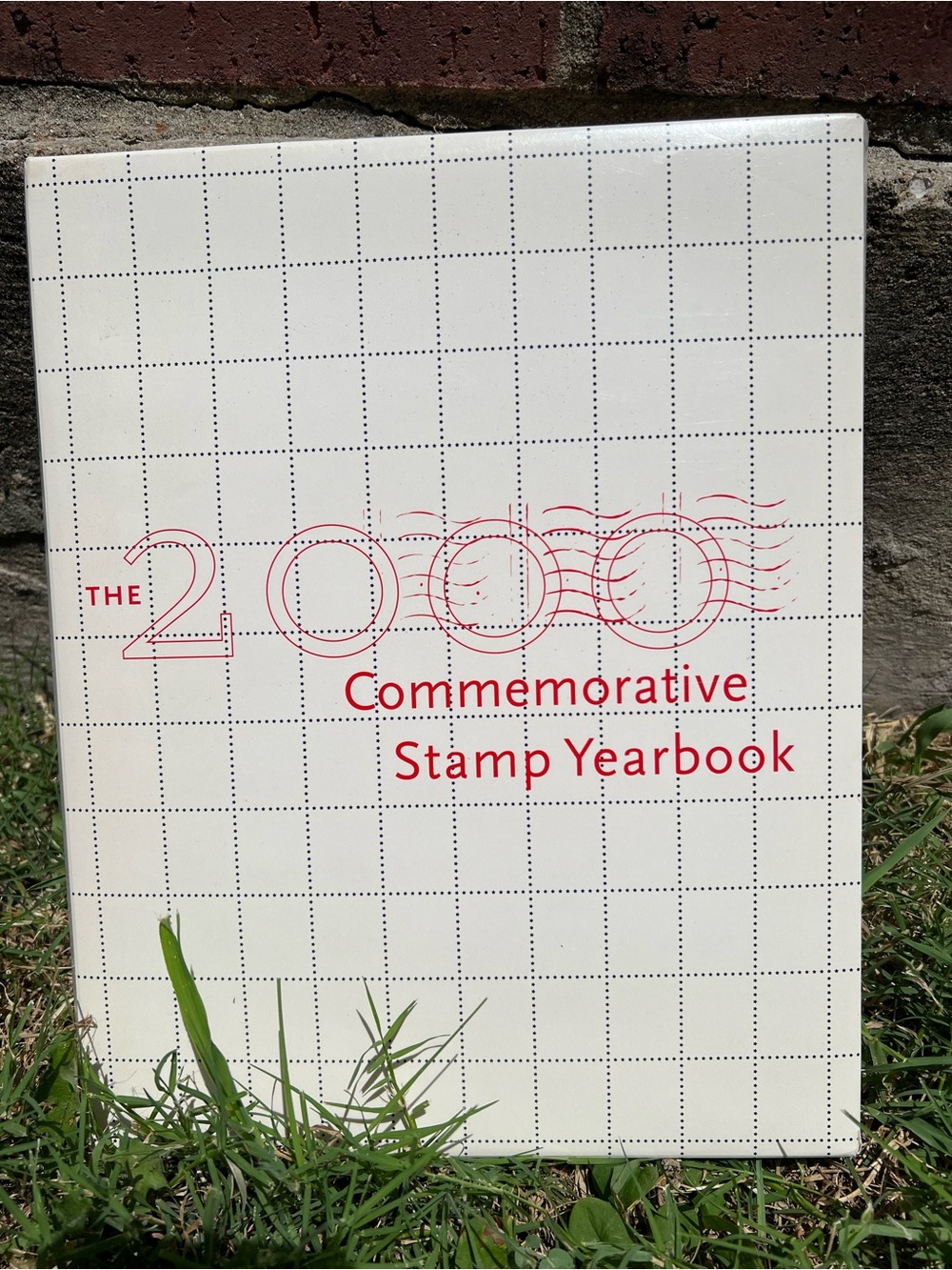 2000 Commemorative Stamp Yearbook - White with Red Text